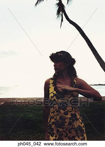 Hawaiian woman dancing at sunset View Large Photo Image Stock Image - Hawaiian woman dancing at sunset . Fotosearch