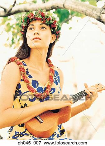 Stock Photo - Hula Dancer Playing Ukelele . Fotosearch