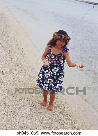Little hula girl dancing at a beach View Large Photo Image Stock Photo - Little hula girl dancing at a beach. Fotosearch