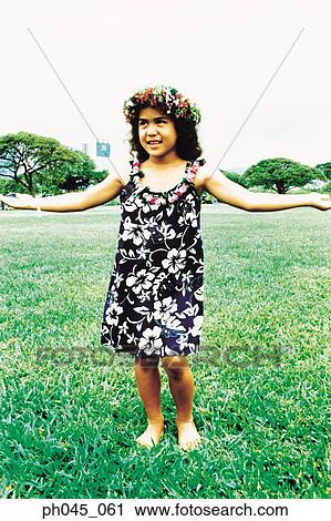 Little hula girl dancing at the field View Large Photo Image Stock Image - Little hula girl dancing at the field. Fotosearch