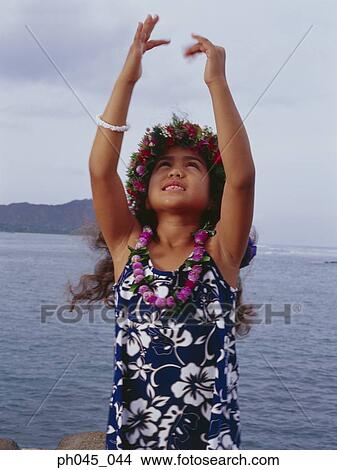 Picture - Little hula girl dancing near ocean. Fotosearch
