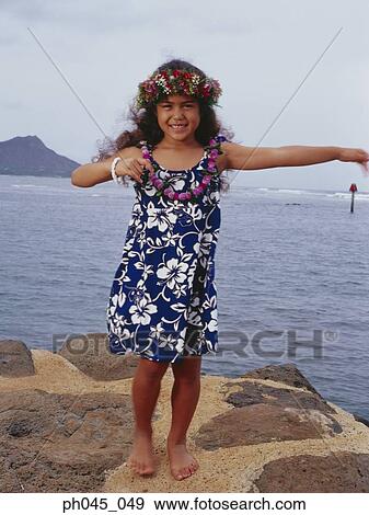 Little hula girl dancing near ocean View Large Photo Image Stock Photo - Little hula girl dancing near ocean. Fotosearch