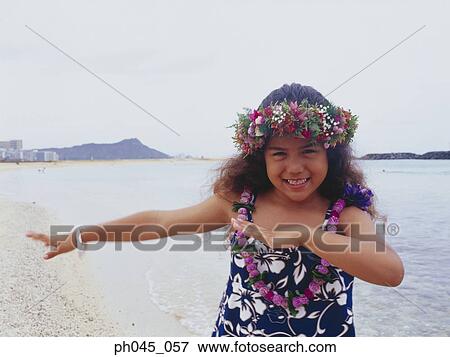 Little hula girl dancing near ocean View Large Photo Image Stock Photo - Little hula girl dancing near ocean. Fotosearch