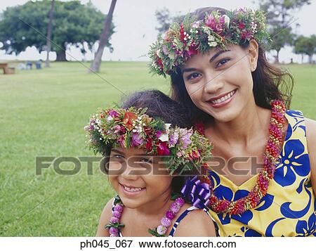 Two sisters wearing traditional hula dancing outfits View Large Photo Image Stock Photo - Two sisters wearing traditional hula dancing outfits . Fotosearch