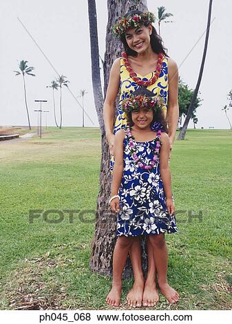Two sisters wearing traditional hula dancing outfits View Large Photo Image Stock Photo - Two sisters wearing traditional hula dancing outfits . Fotosearch