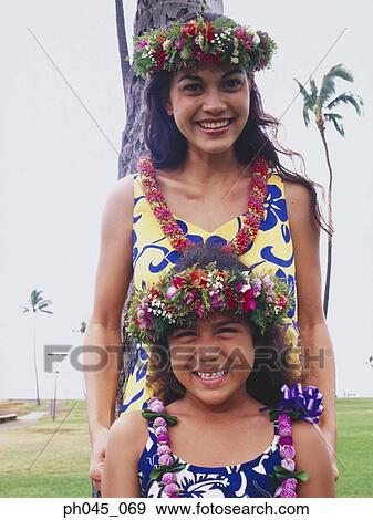 Two sisters wearing traditional hula dancing outfits View Large Photo Image Stock Photo - Two sisters wearing traditional hula dancing outfits . Fotosearch