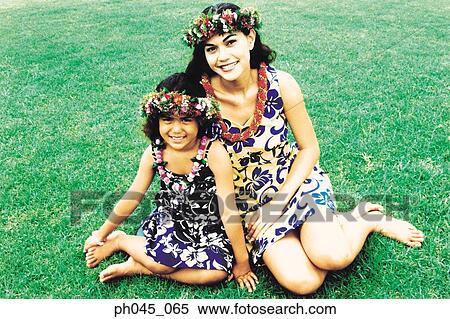 Two sisters wearing traditional hula dancing outfits View Large Photo Image Stock Photography - Two sisters wearing traditional hula dancing outfits . Fotosearch