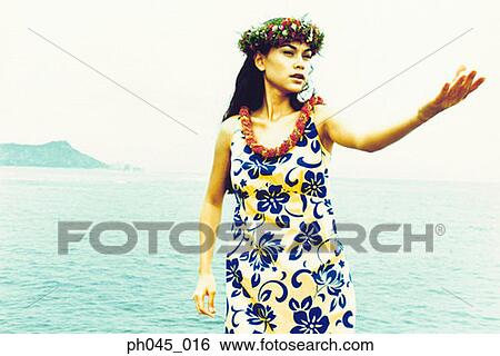 USA, Hawaii, female hula dancer performing near ocean View Large Photo Image Stock Photograph - USA, Hawaii, female hula dancer performing near ocean . Fotosearch