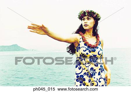 Stock Photography - USA, Hawaii, female hula dancer performing near ocean . Fotosearch