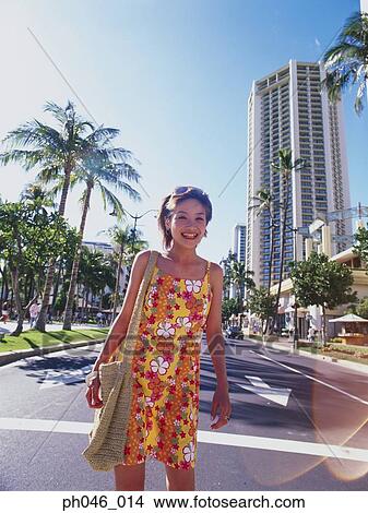 Young woman crossing street, Hawaii View Large Photo Image Picture - Young woman crossing street, Hawaii. Fotosearch