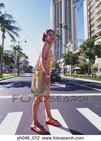 Young woman crossing street, Hawaii View Large Photo Image Stock Image - Young woman crossing street, Hawaii. Fotosearch