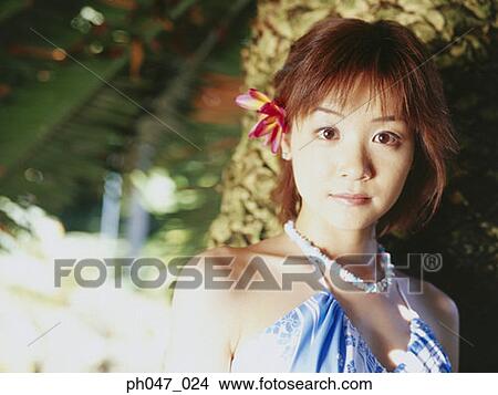 Portrait of young woman in Hawaiian blouse View Large Photo Image Picture - Portrait of young woman in Hawaiian blouse. Fotosearch