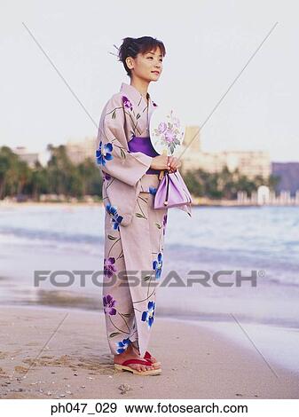 Young woman in Japanese kimono at a beach, portrait View Large Photo Image Stock Photo - Young woman in Japanese kimono at a beach, portrait. Fotosearch