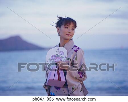 Young woman in Japanese kimono at a beach, portrait View Large Photo Image Stock Photography - Young woman in Japanese kimono at a beach, portrait. Fotosearch