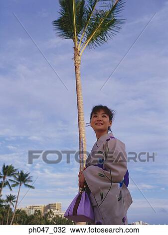 Young woman in Japanese kimono, portrait View Large Photo Image Stock Image - Young woman in Japanese kimono, portrait. Fotosearch