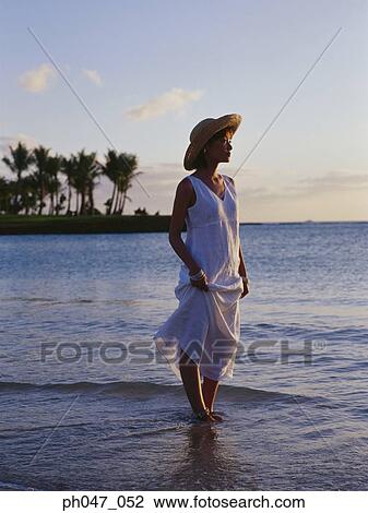Young woman in straw hat on the beach, portrait View Large Photo Image Stock Image - Young woman in straw hat on the beach, portrait. Fotosearch