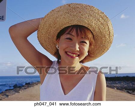Young woman in straw hat, portrait View Large Photo Image Stock Image - Young woman in straw hat, portrait. Fotosearch