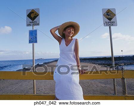 Young woman in straw hat, portrait View Large Photo Image Stock Image - Young woman in straw hat, portrait. Fotosearch