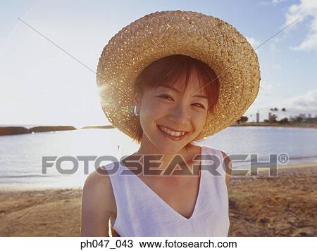 Young woman in straw hat, portrait View Large Photo Image Stock Image - Young woman in straw hat, portrait. Fotosearch