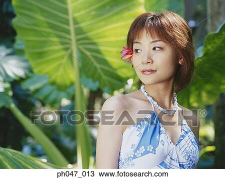 Young woman posing in Hawaiian blouse View Large Photo Image Stock Image - Young woman posing in Hawaiian blouse. Fotosearch