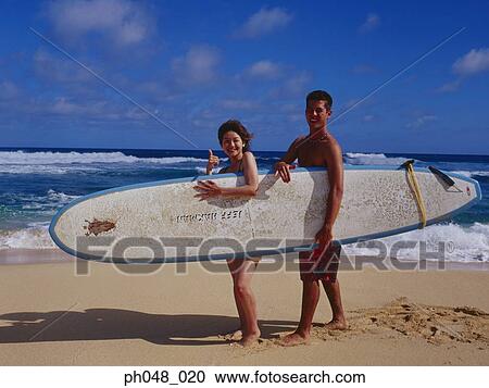 Couple holding surfboard View Large Photo Image Stock Image - Couple holding surfboard. Fotosearch