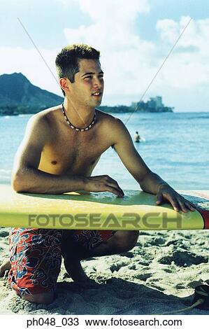Surfer waiting on beach View Large Photo Image Stock Image - Surfer waiting on beach. Fotosearch