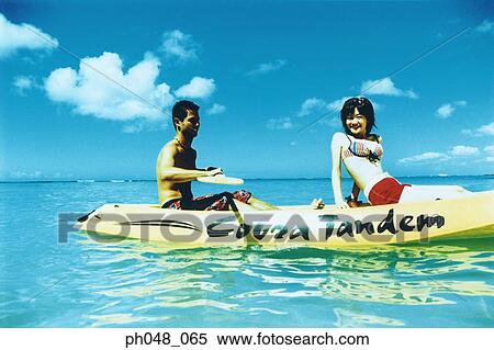 Stock Photography - Young couple Kayaking . Fotosearch