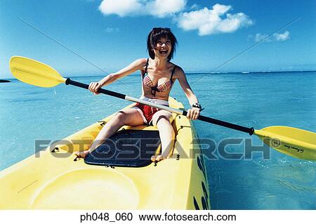 Young woman sea kayaking View Large Photo Image Stock Image - Young woman sea kayaking . Fotosearch