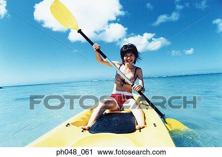 Young woman sea kayaking View Large Photo Image Stock Image - Young woman sea kayaking . Fotosearch