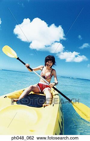 Young woman sea kayaking View Large Photo Image Stock Image - Young woman sea kayaking . Fotosearch