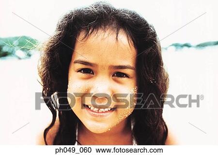Stock Image - Portrait of young Hawaiian girl, close up. Fotosearch