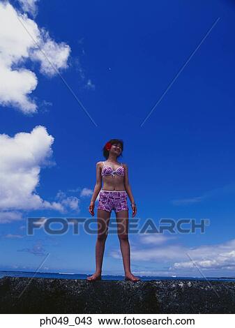 Young woman in bikini at a water breaker View Large Photo Image Stock Image - Young woman in bikini at a water breaker. Fotosearch