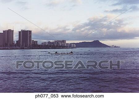 Men canoeing in the ocean, view of Diamond Head, Hawaii View Large Photo Image Stock Image - Men canoeing in the ocean, view of Diamond Head, Hawaii. Fotosearch