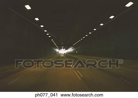 Stock Image - US, Hawaii, Empty road in tunnel . Fotosearch