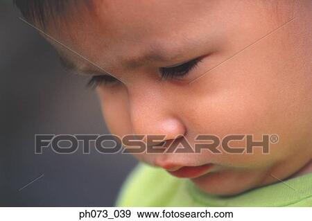 A close view of a young boy View Large Photo Image Stock Photo - A close view of a young boy. Fotosearch