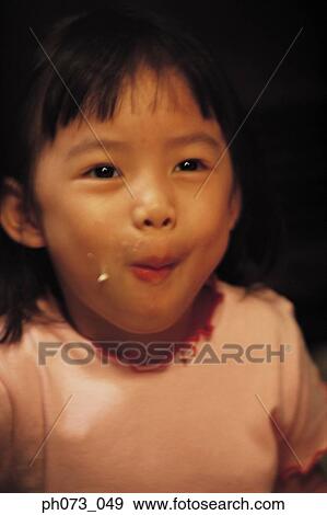 Portrait of a young girl smiling View Large Photo Image Stock Photo - Portrait of a young girl smiling. Fotosearch