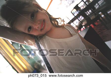 Portrait of a young girl View Large Photo Image Stock Photography - Portrait of a young girl . Fotosearch