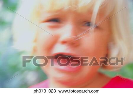 Stock Image - Young girl crying. Fotosearch
