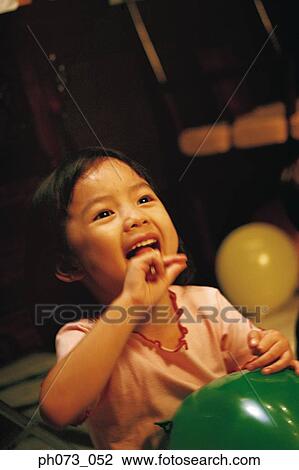 Young girl eating lollipop View Large Photo Image Stock Image - Young girl eating lollipop . Fotosearch