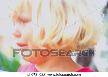Young girl holding yellow flower View Large Photo Image Stock Image - Young girl holding yellow flower. Fotosearch