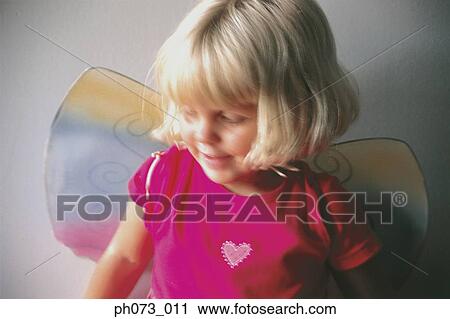 Young girl wearing wings View Large Photo Image Stock Image - Young girl wearing wings. Fotosearch