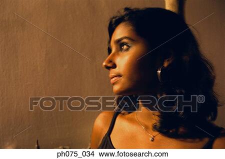Picture - Portrait of young Indian woman, side view. Fotosearch