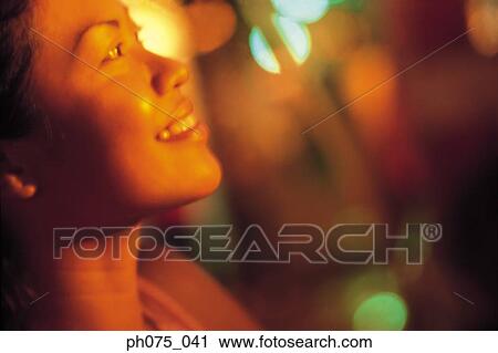Stock Image - Portrait of young Indian woman, side view. Fotosearch