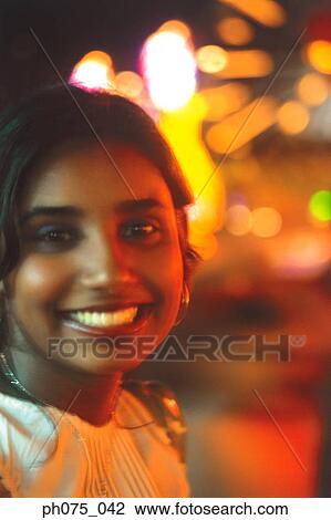 Stock Image - Portrait of young Indian woman, smiling. Fotosearch