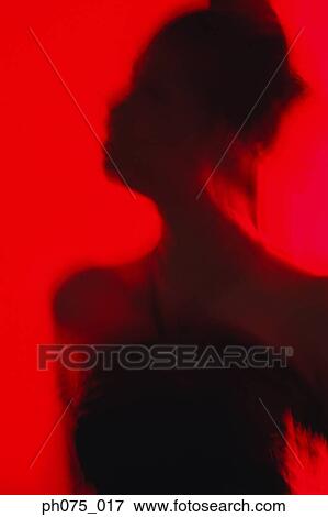Silhouette of young woman in nightclub View Large Photo Image Stock Photo - Silhouette of young woman in nightclub. Fotosearch