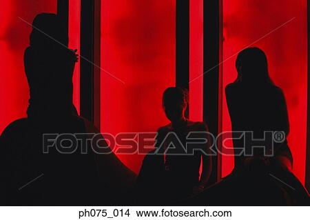 Picture - Silhouette of young women in nightclub. Fotosearch