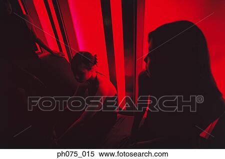 Silhouette of young women in nightclub View Large Photo Image Stock Photography - Silhouette of young women in nightclub. Fotosearch