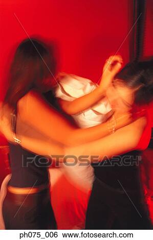 Two young women fighting View Large Photo Image Stock Photograph - Two young women fighting. Fotosearch