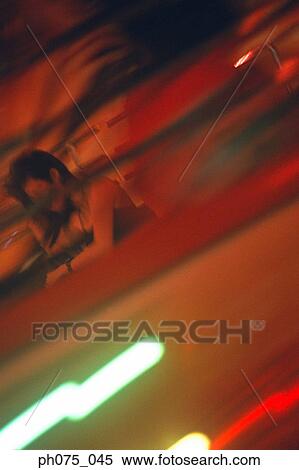 Young woman in ferris wheel, view from below View Large Photo Image Stock Photography - Young woman in ferris wheel, view from below. Fotosearch