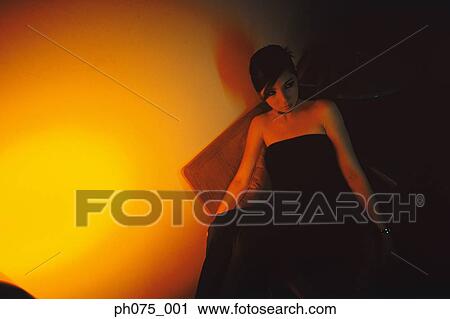 Young woman sitting in nightclub, portrait View Large Photo Image Stock Image - Young woman sitting in nightclub, portrait . Fotosearch